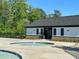 Community pool with a splash pad and seating area available to residents at 3825 Sycamore Hill Dr, Loganville, GA 30052