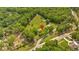 Aerial view showing a house on a large lot, complemented by a neighborhood street at 7783 Cantrell Rd, Douglasville, GA 30135
