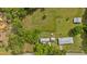 An aerial shot showcases the property with greenery and detached garage at 7783 Cantrell Rd, Douglasville, GA 30135