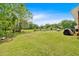 Expansive backyard with lush greenery and mature trees, great for entertaining at 7783 Cantrell Rd, Douglasville, GA 30135
