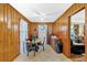 Cozy dining area with wood paneling, simple table setting, and natural light at 7783 Cantrell Rd, Douglasville, GA 30135