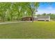 Brick home with covered parking and a spacious lawn at 7783 Cantrell Rd, Douglasville, GA 30135