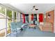 Relaxing screened-in porch with comfortable seating and ceiling fan at 7783 Cantrell Rd, Douglasville, GA 30135