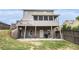 Spacious backyard featuring a wooden deck, screened-in porch, and lower-level patio perfect for entertaining at 13 Cottage Nw Walk, Cartersville, GA 30121