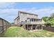 Spacious backyard featuring a wooden deck, screened-in porch, and lower-level patio perfect for entertaining at 13 Cottage Nw Walk, Cartersville, GA 30121
