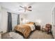 Bedroom with a ceiling fan, accent chair, and a faux fur rug at 13 Cottage Nw Walk, Cartersville, GA 30121