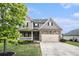 Charming two-story home with a stone facade, two-car garage, and well-manicured lawn at 13 Cottage Nw Walk, Cartersville, GA 30121