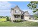 Charming two-story home with a stone facade, two-car garage, and well-manicured lawn at 13 Cottage Nw Walk, Cartersville, GA 30121
