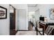 Hallway with hardwood floors leading to various rooms and a view of the living room at 13 Cottage Nw Walk, Cartersville, GA 30121