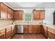 Kitchen with ample storage space, granite countertops and stainless steel appliances ready for cooking at 13 Cottage Nw Walk, Cartersville, GA 30121