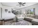 Comfortable living room featuring a large sofa, staircase, and a view of the outdoors at 13 Cottage Nw Walk, Cartersville, GA 30121