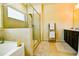 Well lit bathroom featuring walk-in shower, soaking tub, and dual vanities at 165 Craines Vw, Covington, GA 30014
