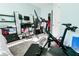 Home office/bedroom featuring a Peloton bike, desk setup and lots of natural light at 165 Craines Vw, Covington, GA 30014