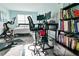 Bright bedroom with a workout area, desk, and bookshelves providing a functional and stylish space at 165 Craines Vw, Covington, GA 30014