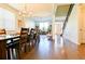 Dining Room with large dining table, hardwood floors, and view to open concept living space at 165 Craines Vw, Covington, GA 30014