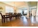 Dining Room with large dining table, hardwood floors, and view to open concept living space at 165 Craines Vw, Covington, GA 30014