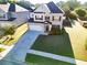 Stunning home with a pristine lawn, a long driveway, and a two-car garage, perfect for Gathering living at 165 Craines Vw, Covington, GA 30014