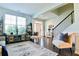 Bright foyer with staircase, hardwood floors, an open concept layout, and seating at 165 Craines Vw, Covington, GA 30014