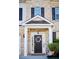 Close up of front door showcasing the door, wreath, and sidelight windows at 165 Craines Vw, Covington, GA 30014