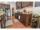 Gourmet kitchen featuring stainless steel appliances, dark wood cabinetry, and granite countertops at 165 Craines Vw, Covington, GA 30014