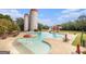 Community pool with two silos, mushroom fountain, waterslide and many chairs and tables at 165 Craines Vw, Covington, GA 30014