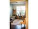 Living room with comfortable seating, shelving, and large window at 165 Craines Vw, Covington, GA 30014