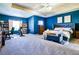 Spacious main bedroom with sitting area, tray ceilings, and abundant natural light at 165 Craines Vw, Covington, GA 30014