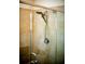 Close up of a shower with a glass door, tiled surround and rainfall shower head at 165 Craines Vw, Covington, GA 30014
