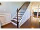 Beautiful wood staircase featuring a dark wood and white trim at 165 Craines Vw, Covington, GA 30014