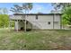 Expansive backyard featuring a deck with staircase, offering ample space for recreation and relaxation at 4170 Maroney Mill Rd, Douglasville, GA 30134