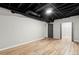 Finished basement area has light wood flooring and view into walk-in closet at 4170 Maroney Mill Rd, Douglasville, GA 30134