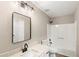 Modern bathroom with an updated vanity, a square black trimmed mirror and a shower-tub combo at 4170 Maroney Mill Rd, Douglasville, GA 30134