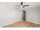 Modern bedroom with hardwood floors, ceiling fan and view to ensuite bathroom at 4170 Maroney Mill Rd, Douglasville, GA 30134