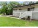 Welcoming home with a white lattice-covered porch, a walkway to the entrance, and vibrant green grass at 4170 Maroney Mill Rd, Douglasville, GA 30134