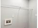 Laundry area has a white wire rack and hookups for a washer and dryer at 4170 Maroney Mill Rd, Douglasville, GA 30134