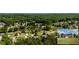 High angle aerial view of a residential community surrounded by dense green trees at 7095 Valley Landing Ct, Cumming, GA 30041