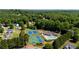Aerial view of community amenities, including tennis courts, pool and a playground at 7095 Valley Landing Ct, Cumming, GA 30041