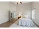 Bright bedroom with high ceilings and wood floors, filled with natural light at 7095 Valley Landing Ct, Cumming, GA 30041