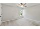 Bedroom with ceiling fan and neutral carpet and walls and one window at 7095 Valley Landing Ct, Cumming, GA 30041