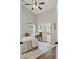 Bedroom with high ceilings, a ceiling fan and an attached bathroom at 7095 Valley Landing Ct, Cumming, GA 30041