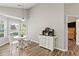 Bright breakfast nook with wood floors and lots of natural light from the surrounding windows at 7095 Valley Landing Ct, Cumming, GA 30041