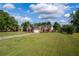 Lovely brick home featuring an attached two-car garage and ample driveway space at 7095 Valley Landing Ct, Cumming, GA 30041