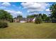 Charming brick home featuring a manicured lawn and long driveway on a sunny day at 7095 Valley Landing Ct, Cumming, GA 30041