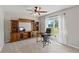 Home office featuring a large window with backyard views and spacious built-in shelving at 7095 Valley Landing Ct, Cumming, GA 30041