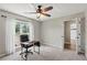 Office with great natural light and double doors that lead into the main dining area at 7095 Valley Landing Ct, Cumming, GA 30041