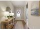 Inviting entryway features hardwood floors and stylish decor with lamps and mirror at 714 Chipping Sparrow St, Canton, GA 30115