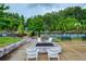 Community outdoor fire pit with chairs, landscaping, and relaxing ambiance at 714 Chipping Sparrow St, Canton, GA 30115