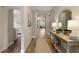 Spacious hallway leading to various rooms with neutral walls and stylish decor at 714 Chipping Sparrow St, Canton, GA 30115