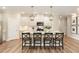 Modern kitchen with stainless steel appliances, quartz countertops, and bar seating at 714 Chipping Sparrow St, Canton, GA 30115
