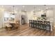 Bright eat-in kitchen with wood floors, island, and stainless steel refrigerator at 714 Chipping Sparrow St, Canton, GA 30115